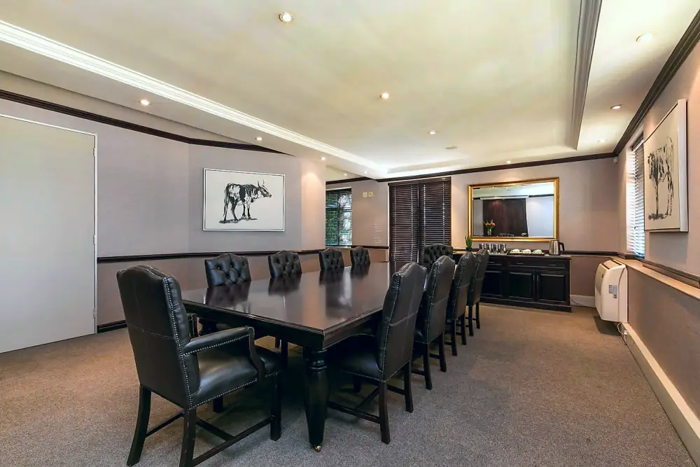 Executive boardroom table and leather chairs at The Workplace serviced offices, Sandton