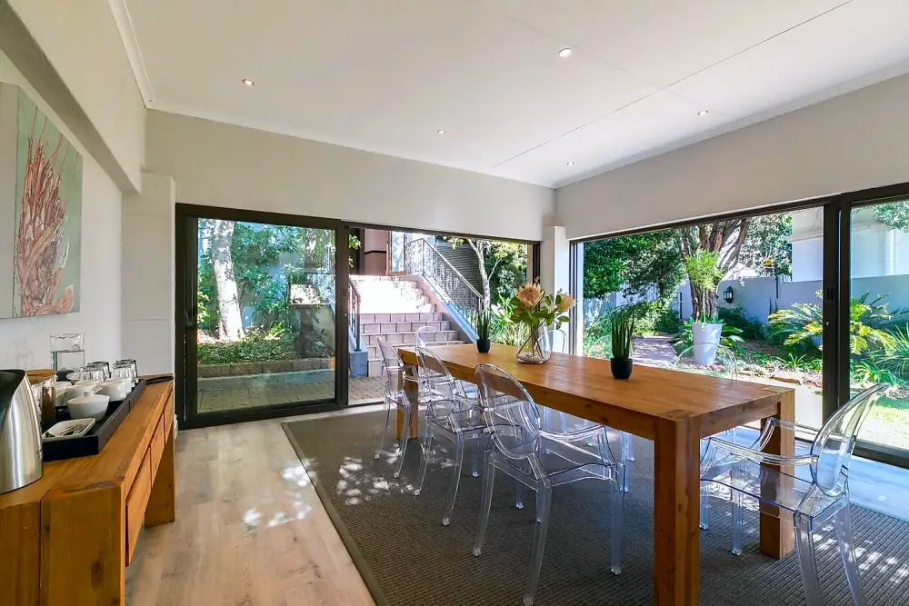 Indoor-outdoor meeting space opening to the gardens at The Workplace, Lonehill