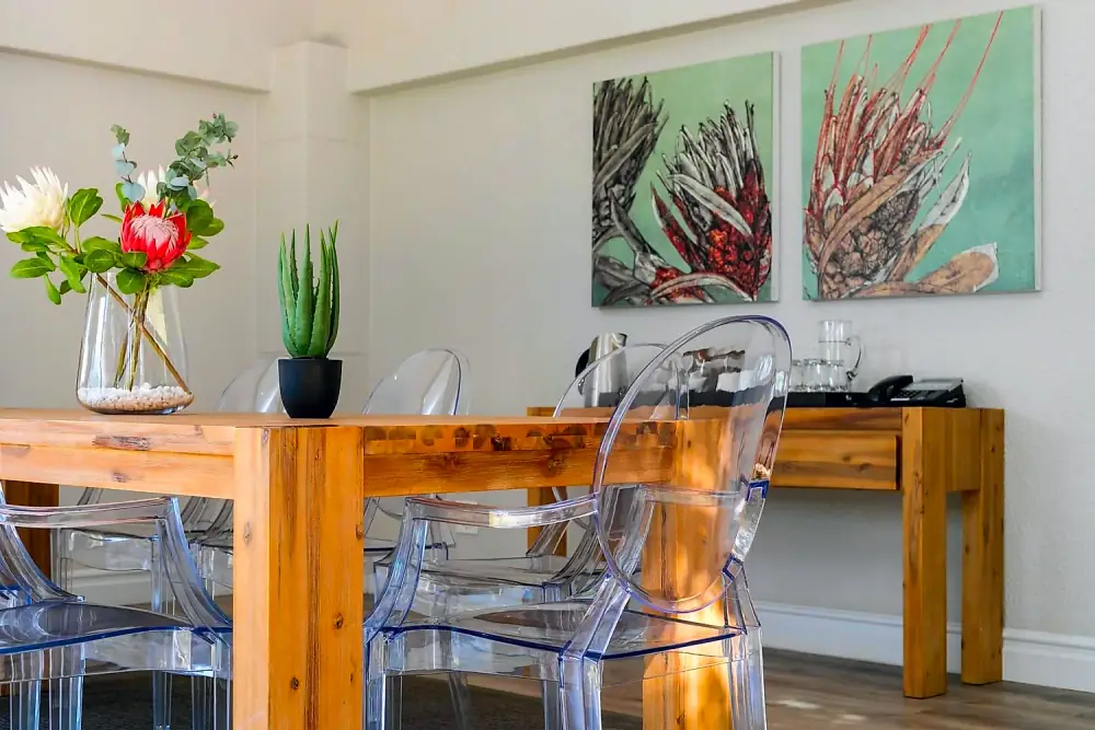 Styled meeting table with proteas and refreshments at The Workplace, Lonehill