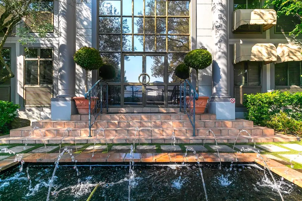 Arched glass entrance to The Workplace at Regent Hill Office Park, Lonehill