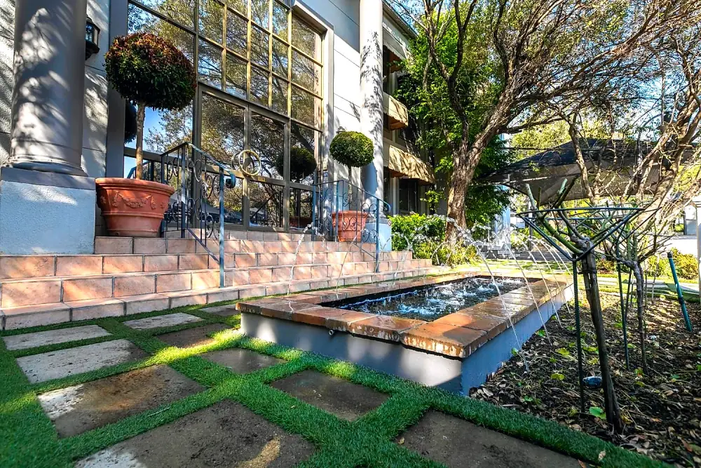 Landscaped water feature and garden path at The Workplace, Lonehill