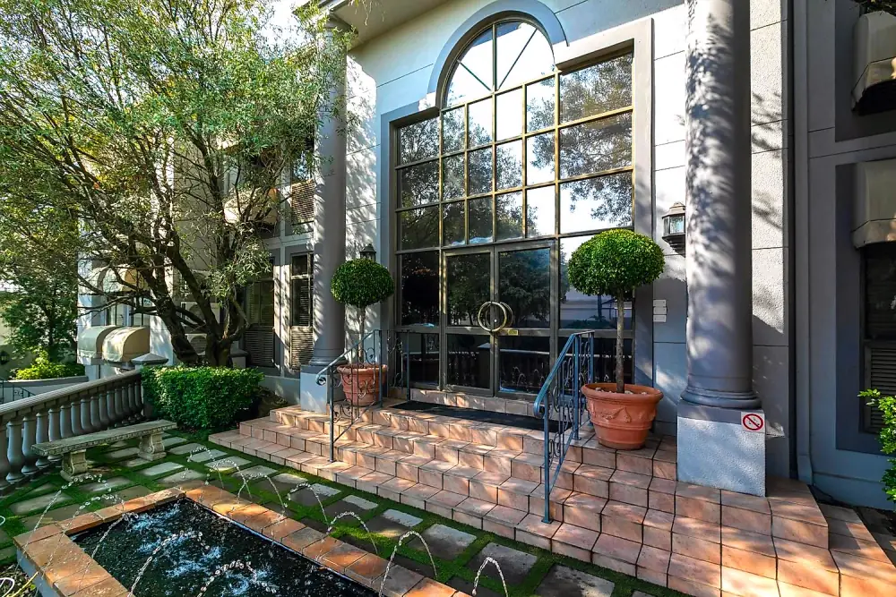 Arched entrance and courtyard fountain at The Workplace, Lonehill, Sandton