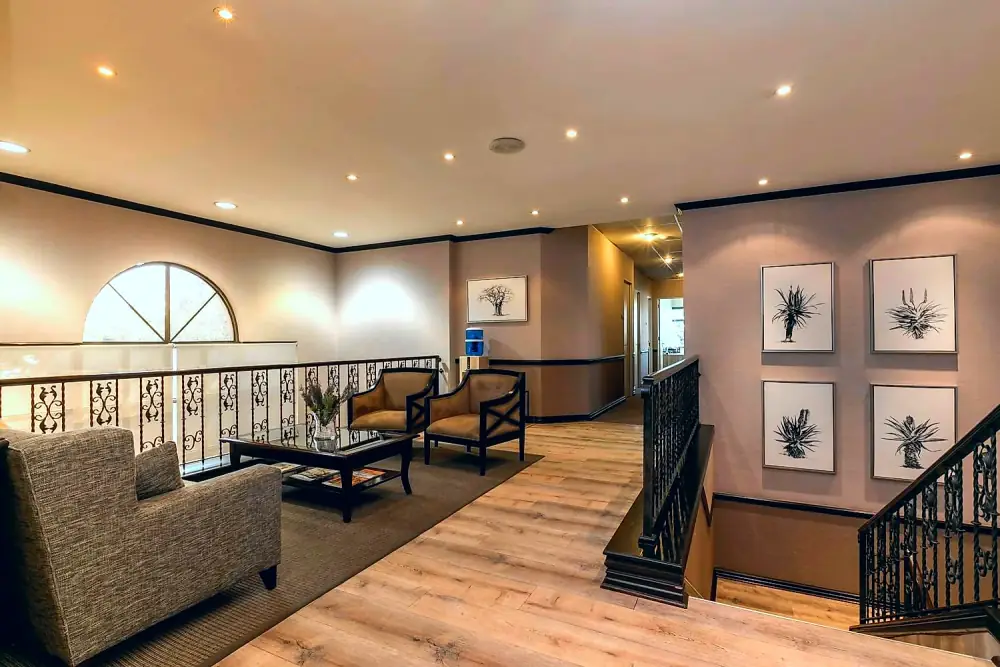 Landing lounge with arched window at The Workplace, Lonehill, Sandton