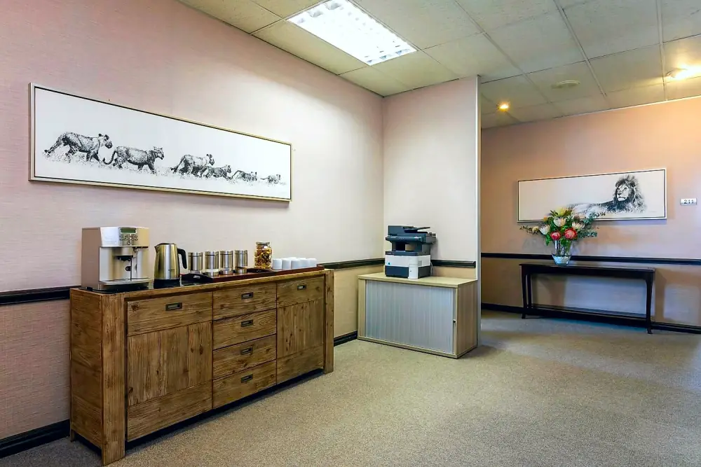Kitchenette and coffee station with wildlife artwork at The Workplace, Lonehill
